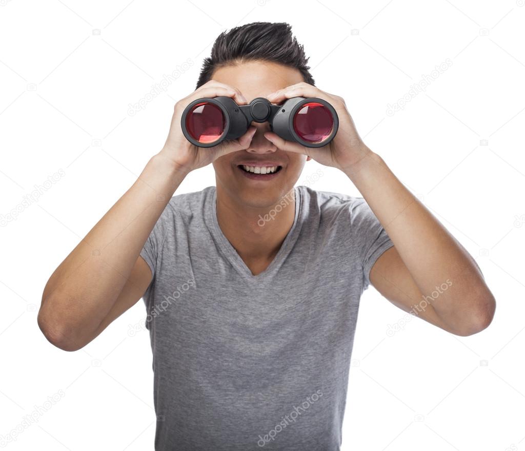 Man looking through binoculars