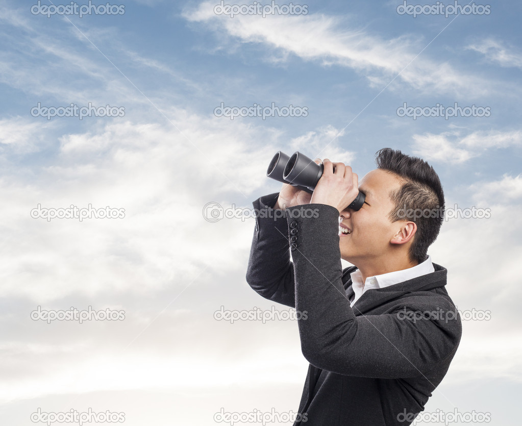 Man looking trough binoculars