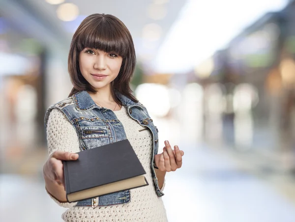 Woman giving book — Stock Photo, Image