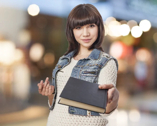 Woman giving book — Stock Photo, Image