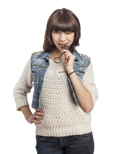 Woman biting key — Stock Photo, Image