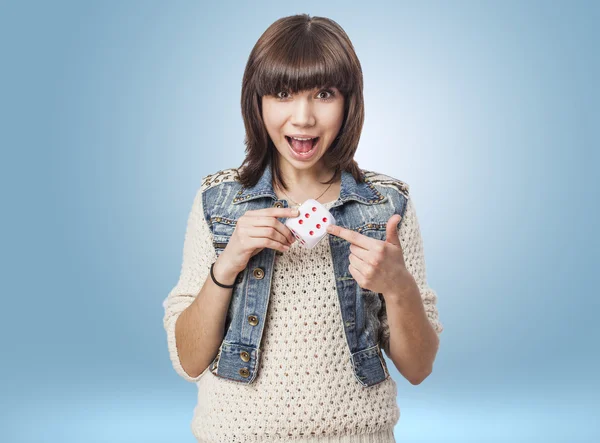 Woman marking dice — Stock Photo, Image