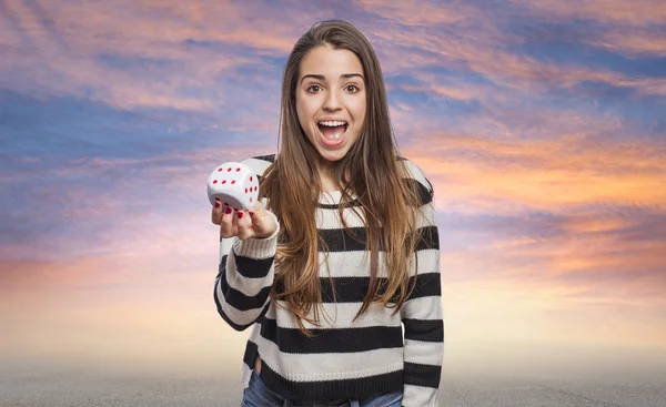 Woman holding dice — Stock Photo, Image