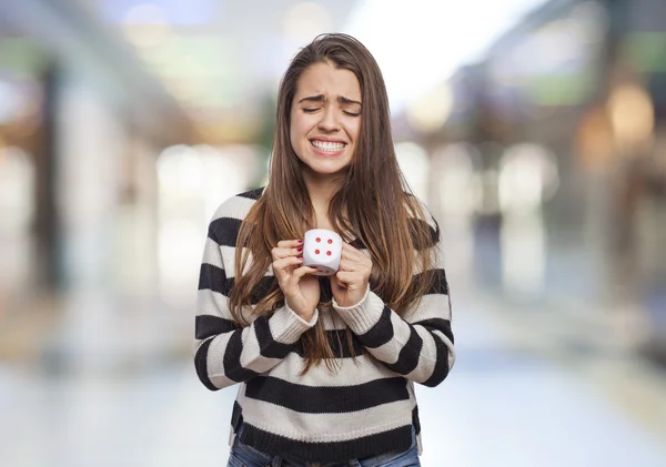 Woman holding dice — Stock Photo, Image