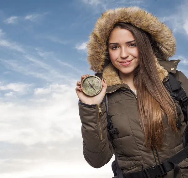 Woman holding compass — Stockfoto