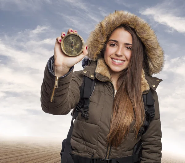 Woman holding compass — Stok fotoğraf