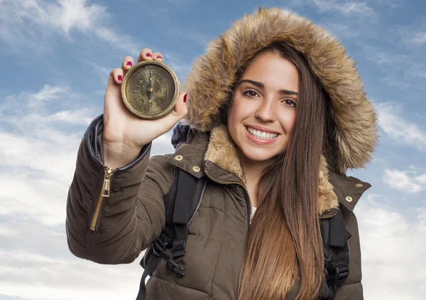 Woman holding compass — Stockfoto