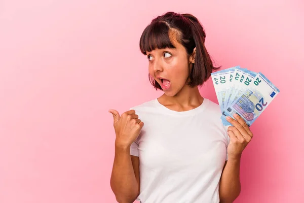 Young Mixed Race Woman Holding Bills Isolated Pink Background Points — Stock Photo, Image