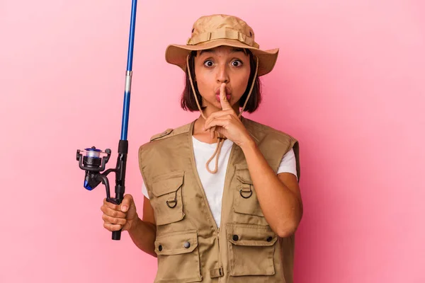 Young Mixed Race Fisherwoman Holding Rod Isolated Pink Background Keeping — Stock Photo, Image