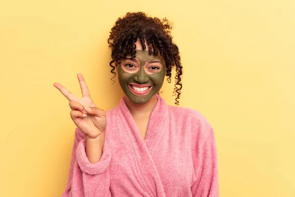 Young Mixed Race Wearing Facial Mask Isolated Yellow Background Showing — Stock Photo, Image