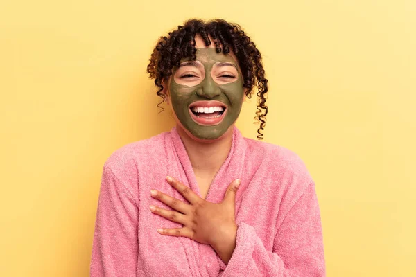 Young Mixed Race Wearing Facial Mask Isolated Yellow Background Laughs — Stock Photo, Image