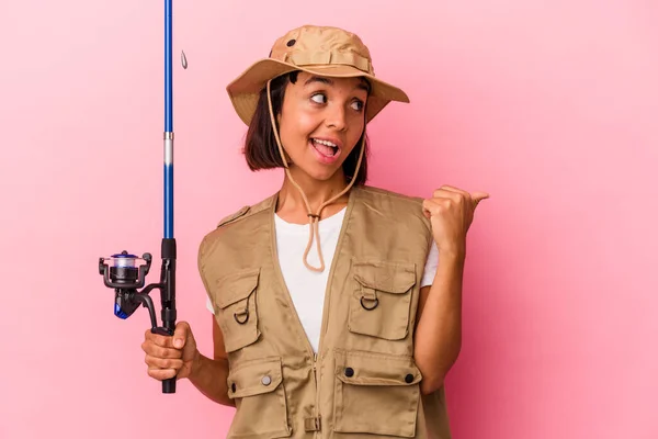 Young Mixed Race Fisherwoman Holding Rod Isolated Pink Background Points — Stock Photo, Image