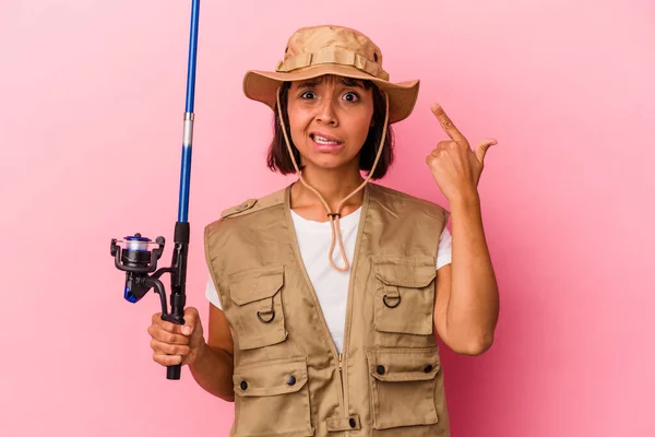 Young Mixed Race Fisherwoman Holding Rod Isolated Pink Background Showing — Stock Photo, Image