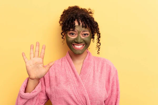 Young Mixed Race Wearing Facial Mask Isolated Yellow Background Smiling — Stock Photo, Image