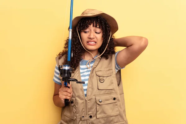 Young Mixed Race Fisherwoman Holding Rod Isolated Yellow Background Touching — Stock Photo, Image