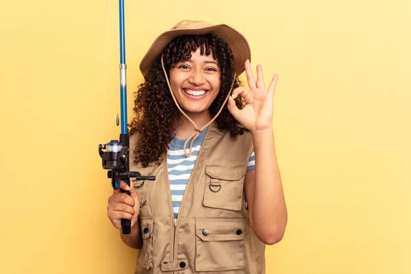 Young Mixed Race Fisherwoman Holding Rod Isolated Yellow Background Cheerful — Stock Photo, Image