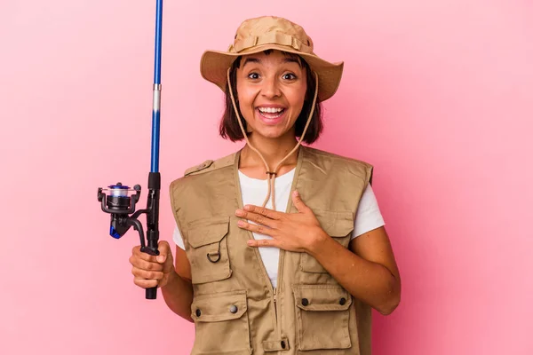 Young Mixed Race Fisherwoman Holding Rod Isolated Pink Background Laughs — Stock Photo, Image