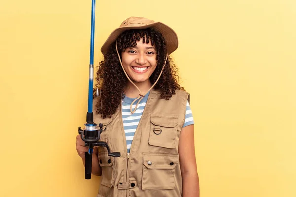 Young Mixed Race Fisherwoman Holding Rod Isolated Yellow Background — Stock Photo, Image