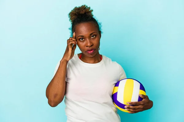 Young African American Woman Playing Volleyball Isolated Blue Background Pointing — Stock Photo, Image