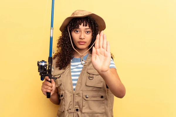 Young Mixed Race Fisherwoman Holding Rod Isolated Yellow Background Standing — Stock Photo, Image