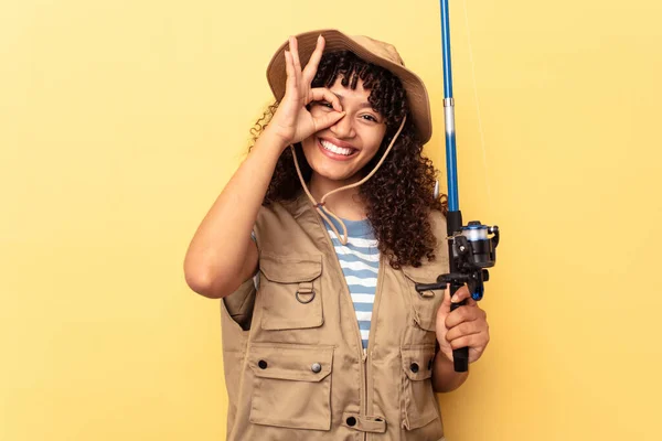 Young Mixed Race Fisherwoman Holding Rod Isolated Yellow Background Excited — Stock Photo, Image