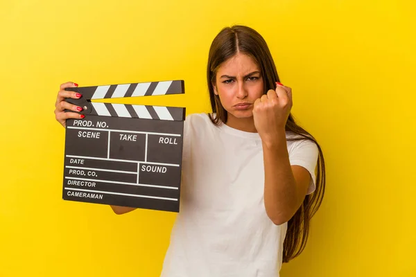 Young Caucasian Woman Holding Clapperboard Isolated White Background Showing Fist — Stock Photo, Image