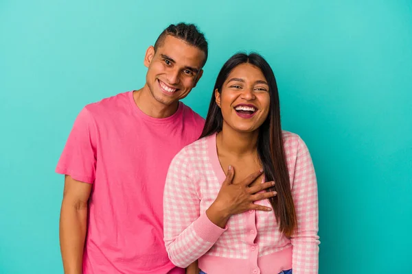 Young Latin Couple Isolated Blue Background Laughs Out Loudly Keeping — Stock Photo, Image