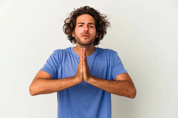 Young Caucasian Man Isolated White Background Holding Hands Pray Mouth — Stock Photo, Image