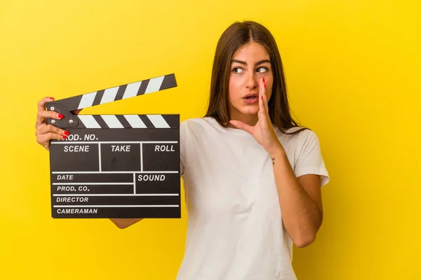 Young Caucasian Woman Holding Clapperboard Isolated White Background Saying Secret — Stock Photo, Image