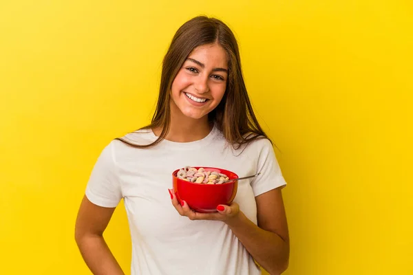Young Caucasian Woman Holding Cereals Isolated Yellow Background Happy Smiling — Stock Photo, Image