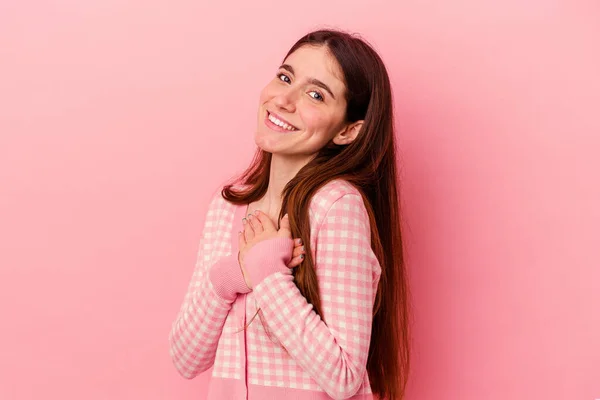 Young Caucasian Woman Isolated Pink Background Has Friendly Expression Pressing — Stock Photo, Image