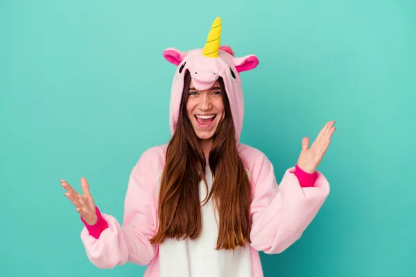 Young Caucasian Woman Wearing Unicorn Pajama Isolated Blue Background Receiving — Stock Photo, Image