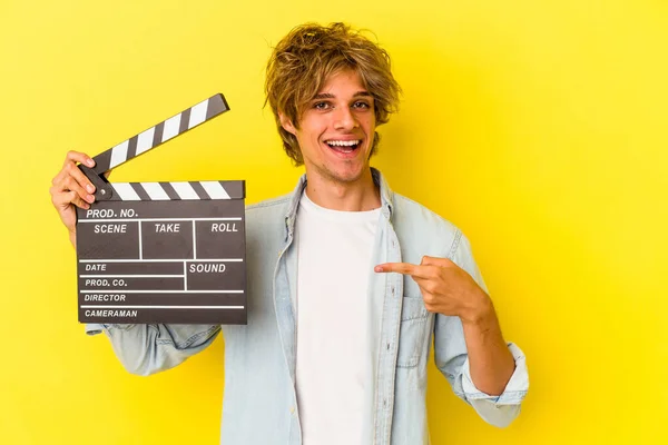 Young Caucasian Man Makeup Holding Clapperboard Isolated Yellow Background Smiling — Stock Photo, Image
