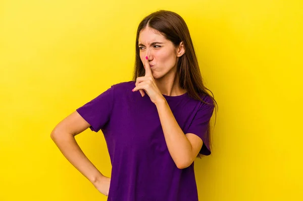 Young Caucasian Woman Isolated Yellow Background Keeping Secret Asking Silence — Stock Photo, Image