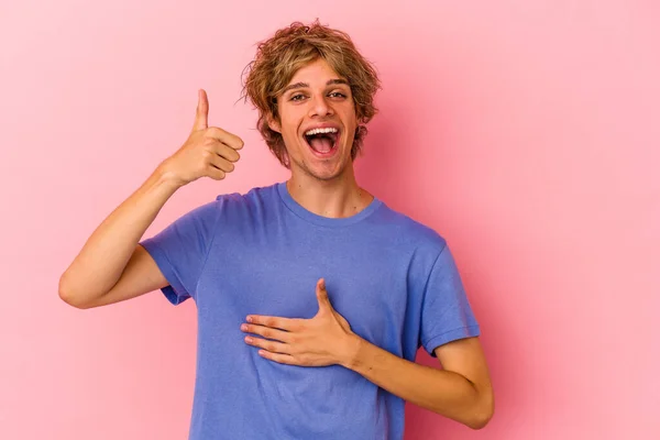 Young Caucasian Man Make Isolated Pink Background Touches Tummy Smiles — Stock Photo, Image