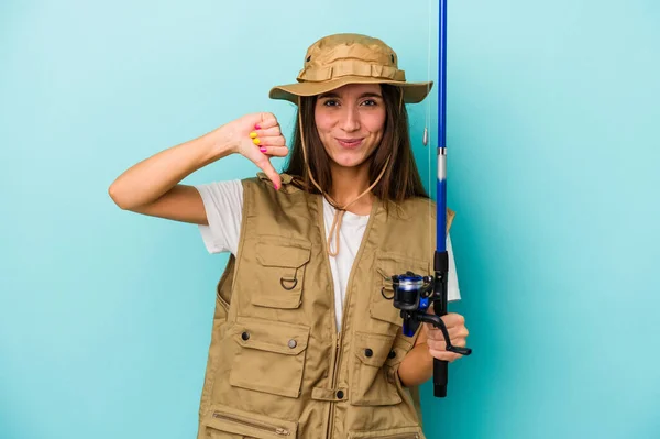 Young Caucasian Fisherwoman Isolated Blue Background Showing Dislike Gesture Thumbs — Stock Photo, Image