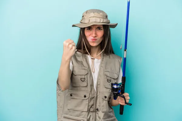Young Caucasian Fisherwoman Isolated Blue Background Showing Fist Camera Aggressive — Stock Photo, Image
