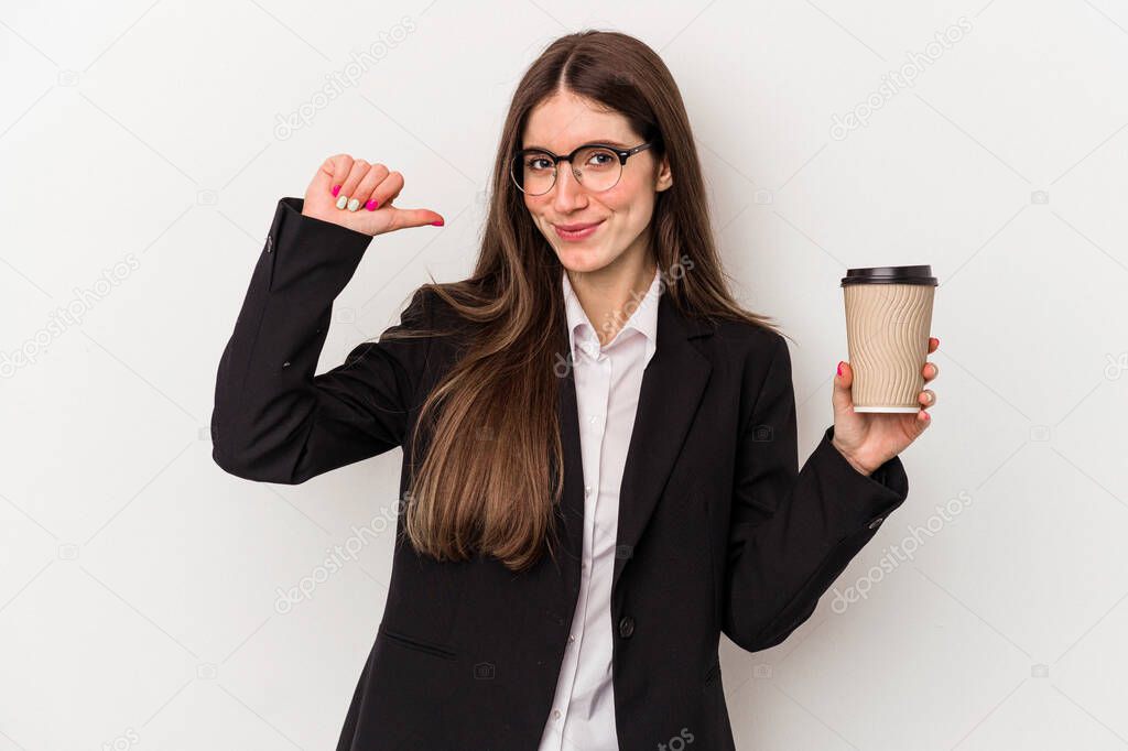 Young caucasian business woman holding a takeaway coffee isolated on white background feels proud and self confident, example to follow.