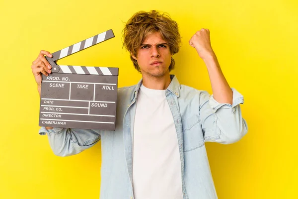 Young Caucasian Man Makeup Holding Clapperboard Isolated Yellow Background Showing — Stock Photo, Image
