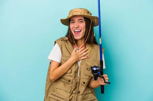 Young Caucasian Fisherwoman Isolated Blue Background Laughs Out Loudly Keeping — Stock Photo, Image