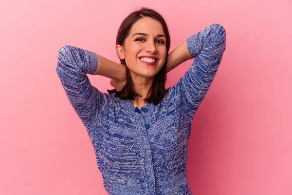 stock image Young caucasian woman isolated on pink background stretching arms, relaxed position.