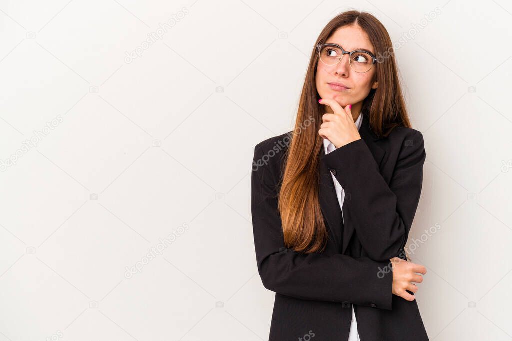 Young caucasian business woman isolated on white background looking sideways with doubtful and skeptical expression.