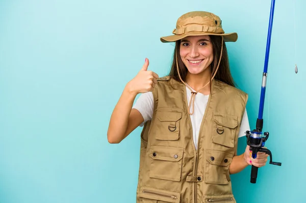 Young Caucasian Fisherwoman Isolated Blue Background Smiling Raising Thumb — Stock Photo, Image