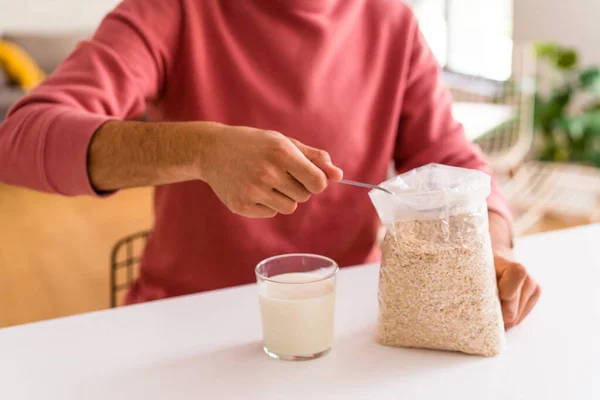 Young Mixed Race Man Eating Oatmeal Milk Breakfast His Kitchen — Stock Photo, Image