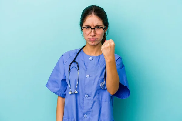 Young Caucasian Nurse Isolated Blue Background Showing Fist Camera Aggressive — Stock Photo, Image