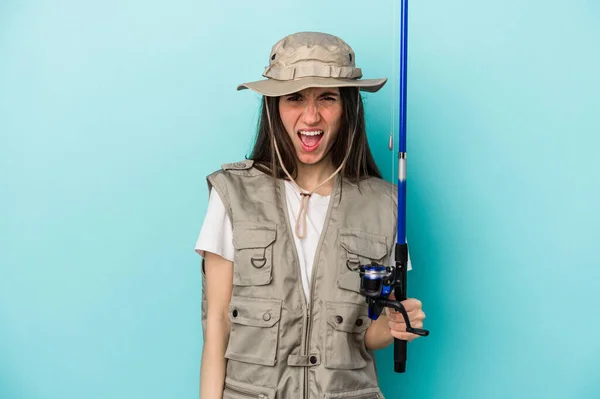 Young Caucasian Fisherwoman Isolated Blue Background Screaming Very Angry Aggressive — Stock Photo, Image