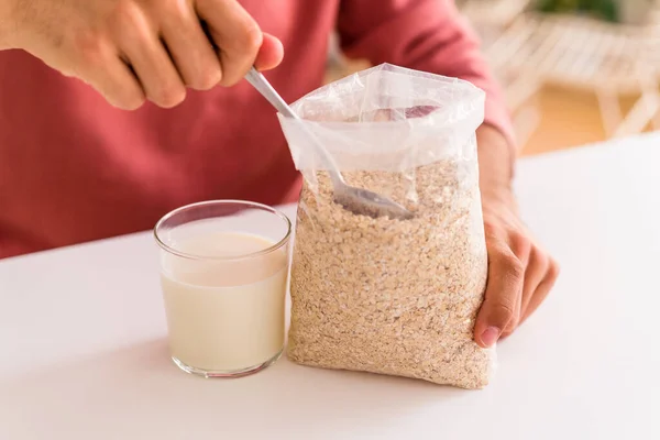 Young Mixed Race Man Eating Oatmeal Milk Breakfast His Kitchen — Stock Photo, Image