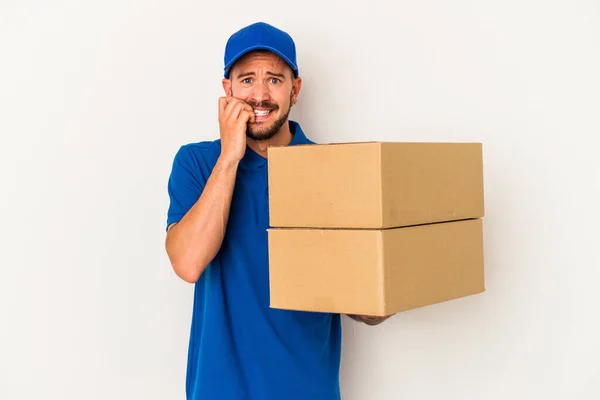 Young Caucasian Delivery Man Tattoos Isolated White Background Biting Fingernails — Stock Photo, Image