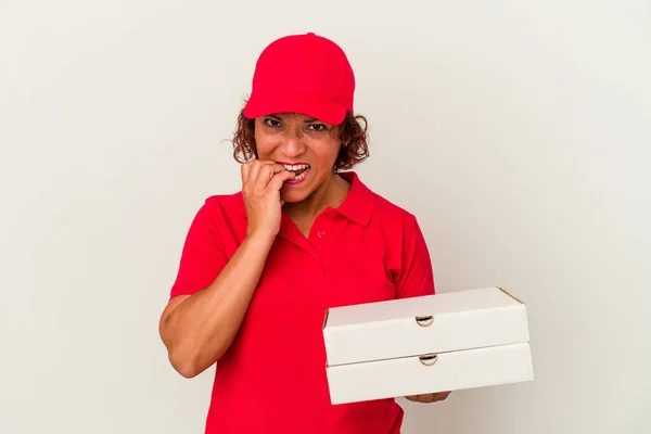 Middle Age Delivery Woman Taking Pizzas Isolated White Background Biting — Stock Photo, Image