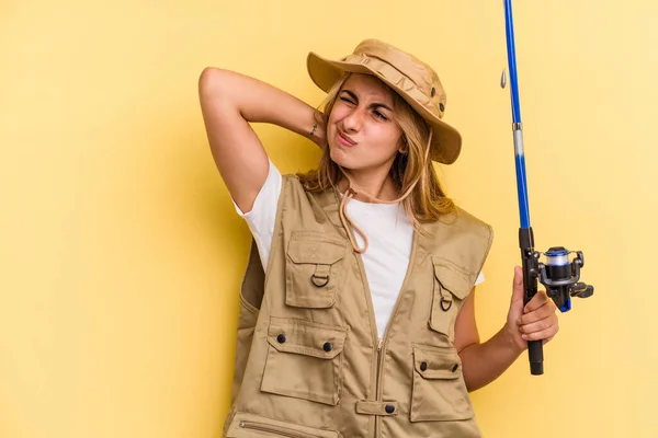 Young Caucasian Blonde Fisherwoman Holding Rod Isolated Yellow Background Touching — Stock Photo, Image